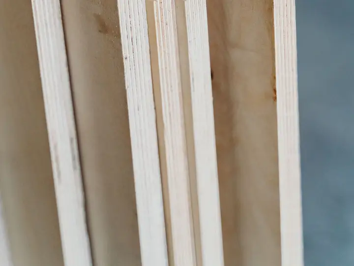 Edges of stacked plywood sheets showing their layers